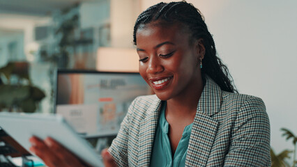 Poster - Tablet, research and black woman in office with reading for online review at magazine agency. Happy, digital technology and female editor working on creative project for with journalism career.
