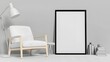 © amorn_m - Minimalist Interior Design Featuring a Cozy Chair and Blank Frame Against a Neutral Wall
