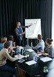 © peopleimages.com - Man, presentation and colleagues in office or meeting, business planning and white board demonstration. Presenter, company and goals or idea with strategy, collaboration with professional for project