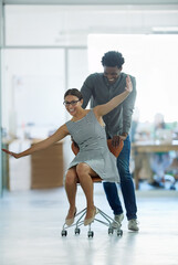 Aufkleber - Employees, fun and pushing chair in office with game for company culture, celebrate and team building. Man, woman and riding sitting on seat in workplace for support, relationship and work husband