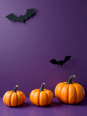 Aufkleber - Small Pumpkins And Bat Silhouettes Adorn A Dark Violet Background With Plenty Of Empty Space In This Halloween Decoration Photo.