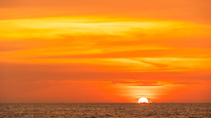 Wall Mural - red sunset, sky clouds sun dawn over sea and fishing boat in the evening with orange, yellow gold su
