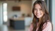 © natakot - A radiant young woman with long, flowing hair beams with joy in a stylish, contemporary setting. Her genuine smile and relaxed posture create an inviting atmosphere, perfect for showcasing happiness