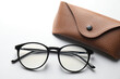 © New Africa - Case with stylish glasses on light background