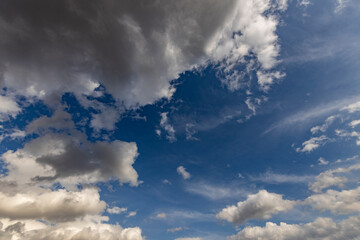Wall Mural - the sky is blue with a few clouds scattered throughout