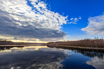 Wall Mural - the sky is cloudy and the water is calm