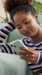 Fototapete - Phone, relax and thinking with woman on sofa in living room of home for app or social media browsing. Chatting, internet and text message with person in apartment for communication or networking