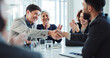 © peopleimages.com - Happy, businessmen and applause with handshake for partnership, agreement or good deal at conference. Business people, colleagues or employees shaking hands with team for introduction at workplace