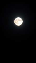 Wall Mural - Close-up of a full moon glowing brightly in a dark night sky, stars, full moon, cosmic