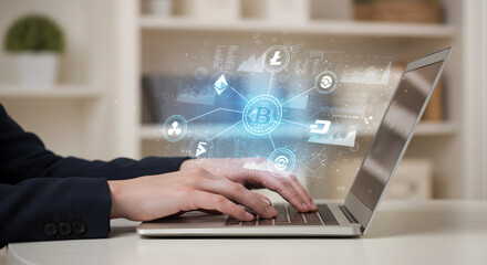 Poster - Person Typing on Silver Laptop with Floating Digital Currency Icons on White Desk and Blurred Background
