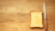 © Sentot - Slice of Toast on Wooden Table