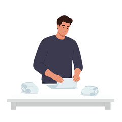Poster - Man folding a sheet of paper in a modern flat vector illustration