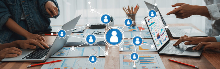 Fototapete - Panorama shot analyst team utilizing BI Fintech to analyze financial report with laptop. Businesspeople analyzing BI power dashboard displayed on laptop screen for business insight. Scrutinize Amity