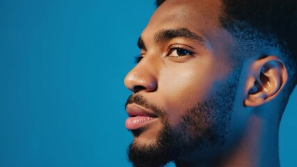 Aufkleber - A close-up shot of a man with a beard, focused on his facial features.