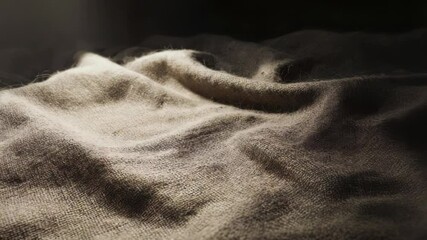 Poster - A close-up shot of a blanket on a bed, ideal for use in interior design or bedroom scene illustrations.