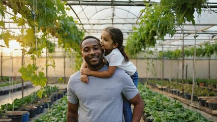 Poster - A fatherly figure holds a young girl's hand in a lush, green environment.