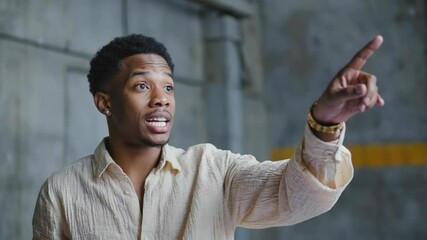 Poster - A person wearing a white shirt points at something, possibly giving directions or highlighting an important point.