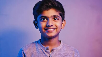 Poster - A young boy smiling while holding a cell phone.