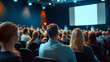 © Oleksandr - Corporate audience listens to presenter at conference event. Business people crowd at professional seminar. Speaker gives