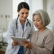© organik - Smiling healthcare worker with tablet supporting patient in hospital