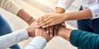 © BARLOP - Diverse Team Stacking Hands in Unity and Collaboration.