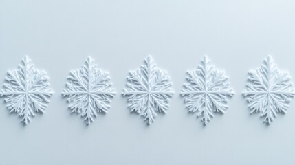 Poster - a pristine arrangement of five intricately crafted snowflake ornaments, set against a delicate light blue backdrop, evokes the essence of winter's serene beauty and holiday spirit