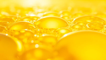 Poster - Close-Up View of Bubbles in Yellow Liquid Creating a Soft and Dreamy Background with Abstract Shape Patterns and Textures
