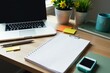 © chanwut - Neatly organized desk with a laptop, notepad, pen, paper clips, sticky notes, and a potted plant, laptop, plant