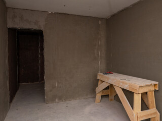 Poster - A room with a wooden table and a pair of scissors on it