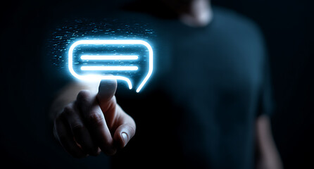the glowing message bubble. man's finger touching message bubble and concept. capturing instant conn