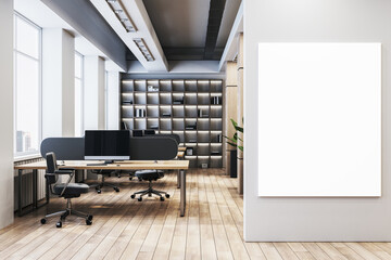 Poster - Modern spacious office interior with desks, computers, shelves, and a vertical blank poster frame on the wall by the entrance area. 3D Rendering