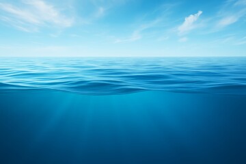 Wall Mural - Tranquil Blue Waters Under a Clear Sky with Gentle Wave Patterns