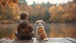 © Vlad - A young child and their canine companion sit side - by - side on a dock gazing out at a serene lake surrounded by autumnal foliage in a tranquil scene of companionship