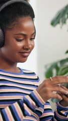 Poster - Happy, black woman or listening with headphones to music for audio streaming on sofa at home. Female person, user or sound with smile on mobile smartphone or app for playlist, album or relax at house