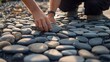 © ArpPSIqee - Landscaper installing decorative stone pathway at urban plaza. Featuring design and functionality