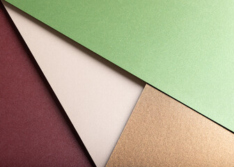 Aufkleber - Paper background with matte texture. Layered diagonal sheets in burgundy, maroon, pastel green, champagne, soft beige, and metallic brown tones, smooth elegant surface, stylish natural contrast..
