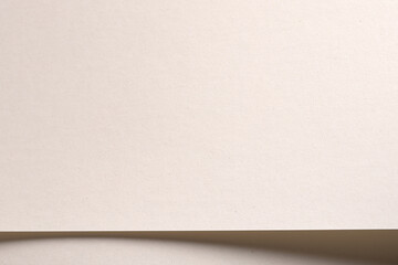 Poster - Paper background with matte texture. Smooth soft surface in white, cream, and light beige tones, warm pastel light, elegant minimal design, natural refined composition, visual simplicity..