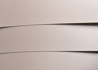Aufkleber - Paper background with satin pearlescent texture. Matte folded horizontal strips, smooth layered surface in champagne and pale gold hue, elegant abstract composition with subtle visual rhythm..