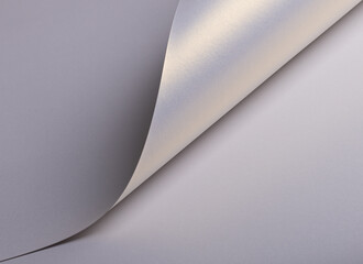 Poster - Paper background with satin texture. Folded smooth surface with pearlescent sheen, pale lilac and lavender gradient, warm highlight, elegant minimal design, soft muted glow..