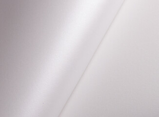 Aufkleber - White pearl paper background with a glossy satin texture and vertical, minimal folds. Icy silver and pale grey tones create a soft, elegant, and luxurious monochrome design with subtle shimmer,.