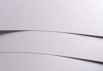 Aufkleber - White pearl paper background with a satin, glossy texture and softly curved, layered folds. Pale grey and icy silver abstract composition.