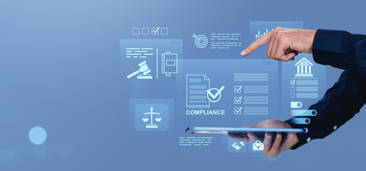 Poster - Businessman interacting with compliance and legal regulation icons on digital screen with futuristic creative background in blue tone.