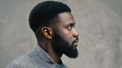 Aufkleber - A portrait of a bearded man with a serious expression.
