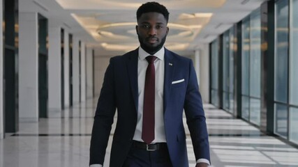 Poster - A professional walking down a corporate hallway, suitable for office or business settings.