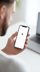 Poster - Man using smartphone to access digital content while sitting at desk, modern workspace with laptop and minimalistic design, technology concept