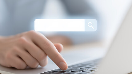 Poster - Searching online with a laptop, focused hand on keyboard, digital search bar visible, technology and information concept