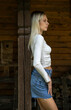 © Andrey_Arkusha - Young sexy blonde model in a short denim skirt
