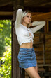 © Andrey_Arkusha - Young sexy blonde model in a short denim skirt