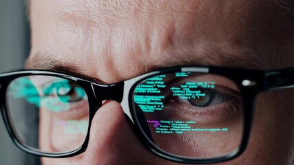 Aufkleber - Programmer wearing glasses reflecting brightly illuminated code lines, showcasing deep technological concentration and innovative problem solving during software development