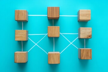 Poster - Wooden blocks connected by string on a blue background forming a network like structure from above view